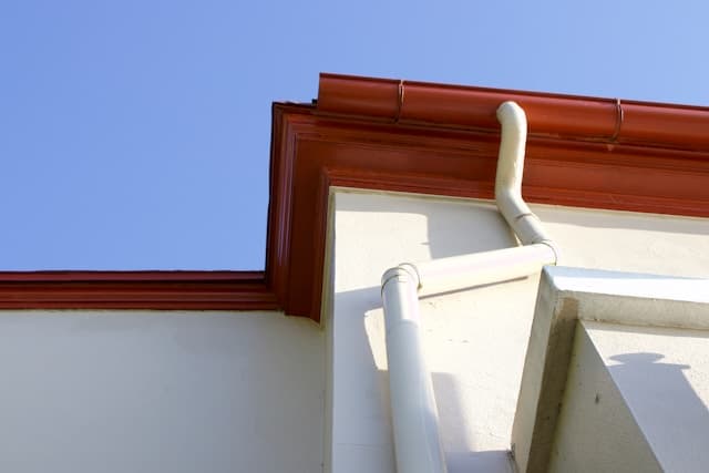 New residential gutter installation along a clean roofline